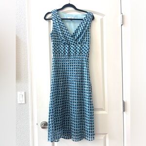 Vintage Y2K Fit and Flare retro dot midi dress. Lined. Tie back Crossover v neck